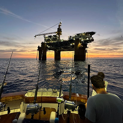 Sunrise at the offshore oil rigs in Gulf of America
